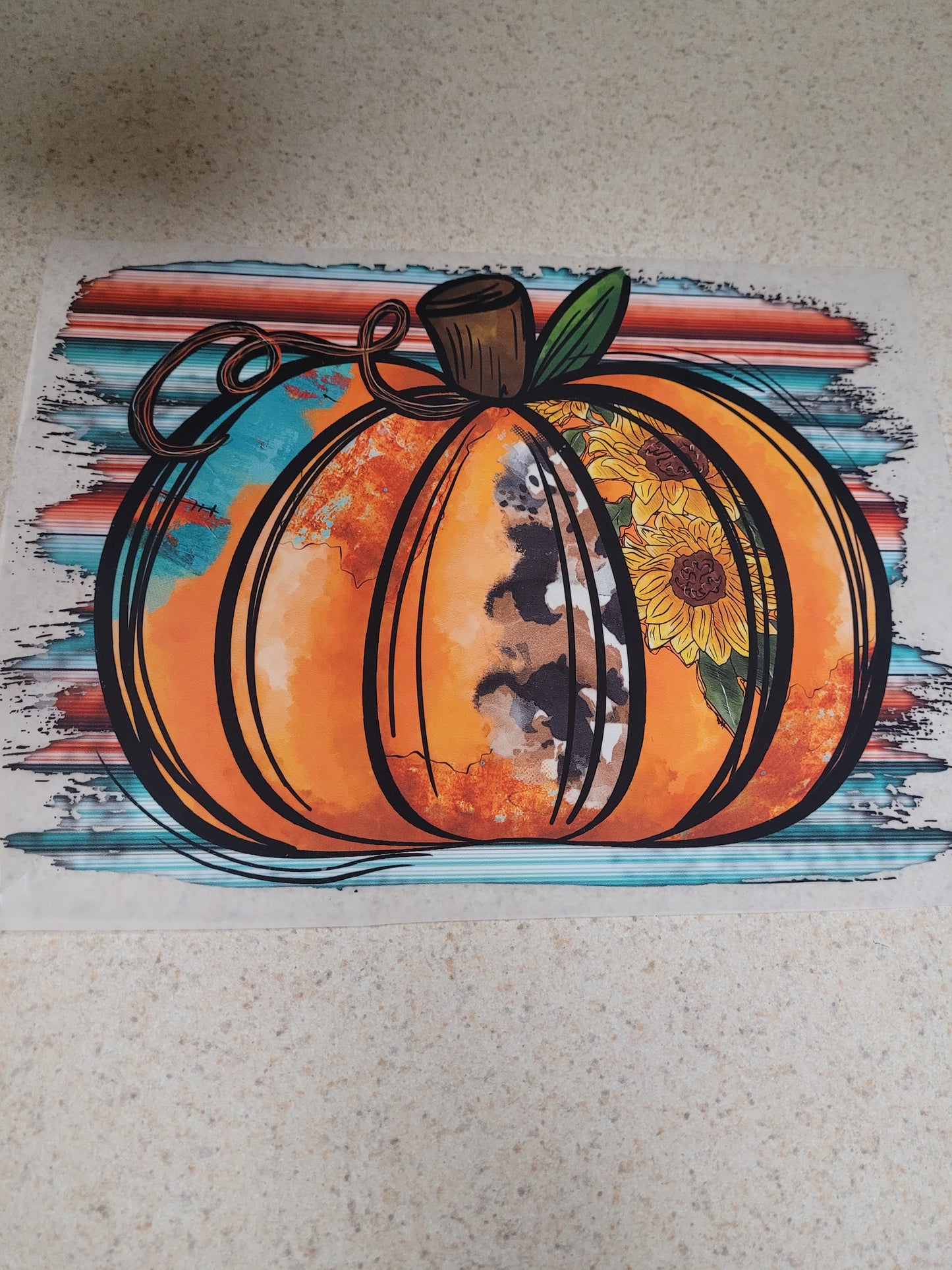 Pumpkin with suflowers in middle