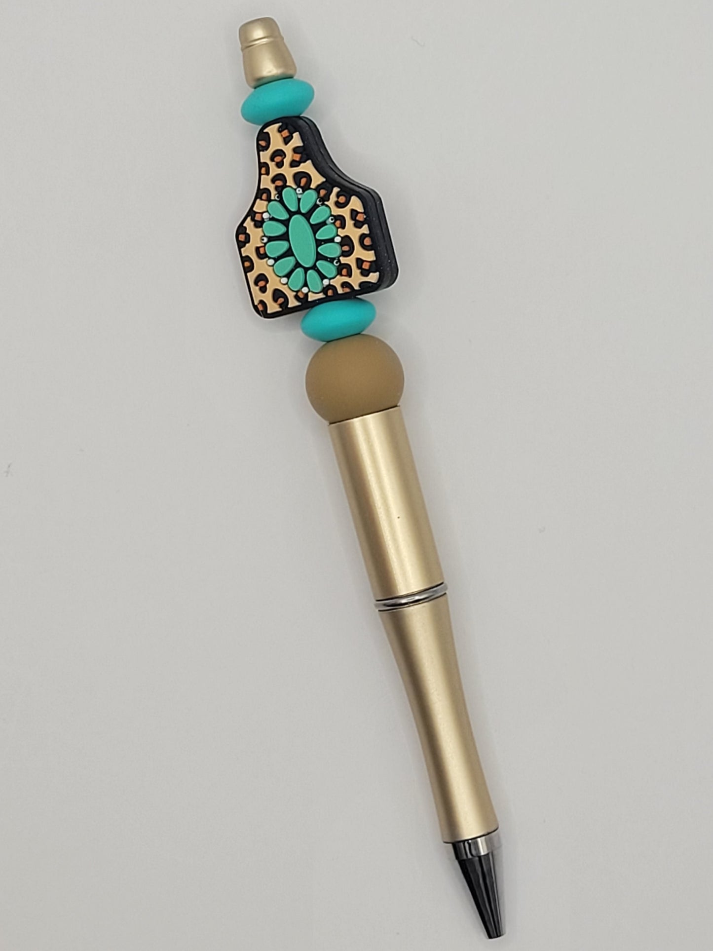 teal and leopard pen