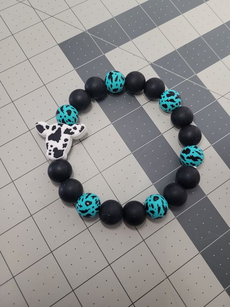 Turquoise and black cow wristlet